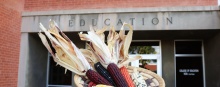 A basket of corn with the Education building in the background