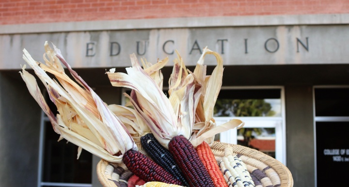 A basket of corn with the Education building in the background